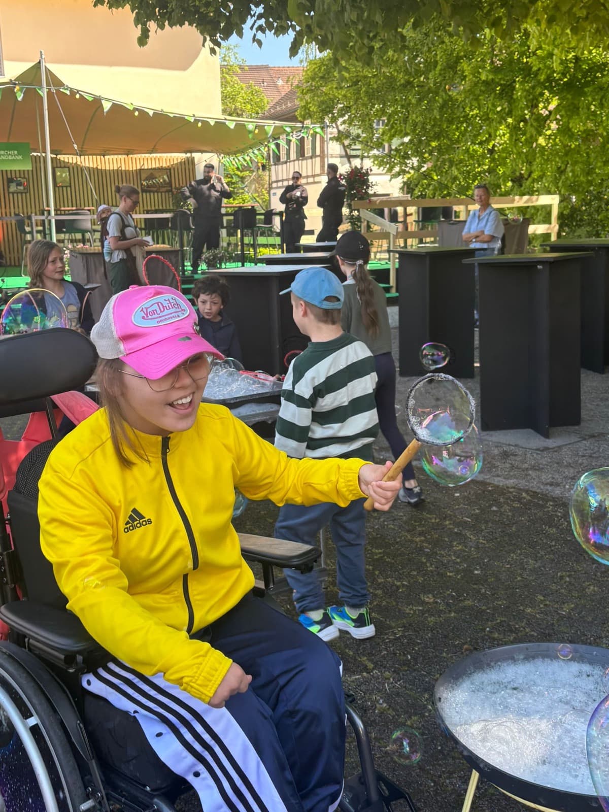Concentrating on blowing a giant soap bubble